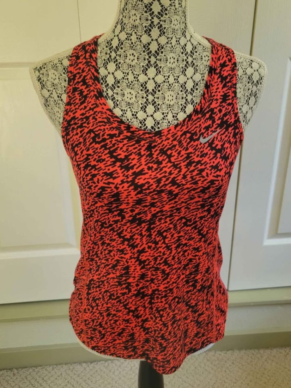 Nike Dri-Fit Racerback Running Tank Top In A Coral And Black Abstract Pattern